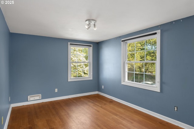 205 NE Billingher Dr, Portland, OR 97220 - empty room featuring baseboards, visible vents, and wood finished floors