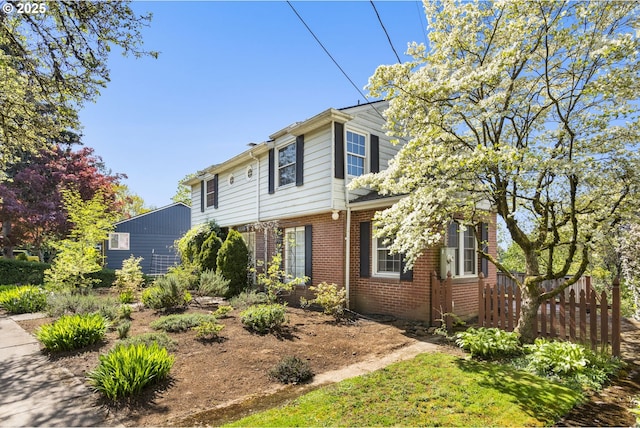 205 NE Billingher Dr, Portland, OR 97220 - view of side of property with brick siding and fence