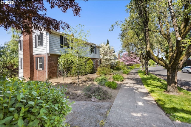 205 NE Billingher Dr, Portland, OR 97220 - view of side of home featuring brick siding