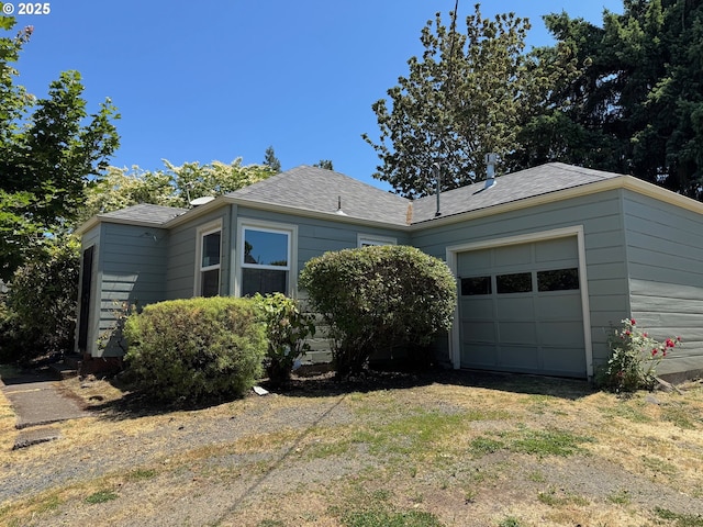 810 W 18th Ave, Eugene, OR 97402 - view of front of house with a garage and roof with shingles