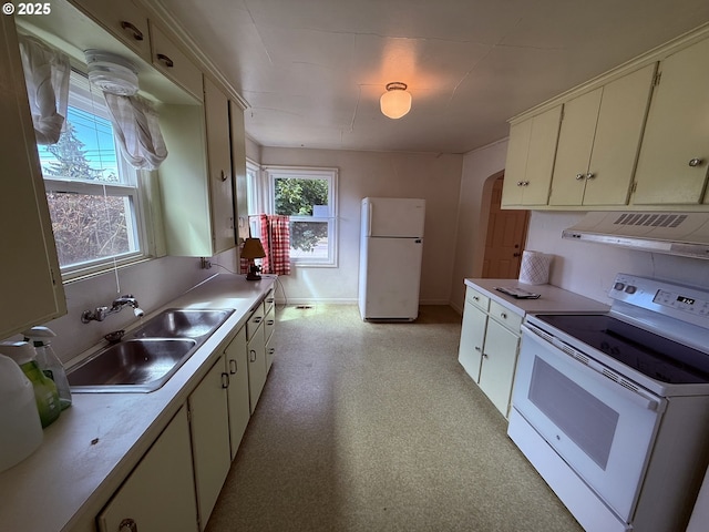 810 W 18th Ave, Eugene, OR 97402 - kitchen featuring white appliances, exhaust hood, light countertops, and arched walkways