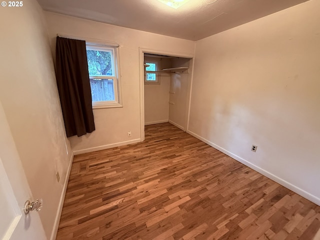 810 W 18th Ave, Eugene, OR 97402 - unfurnished bedroom with wood finished floors and a closet
