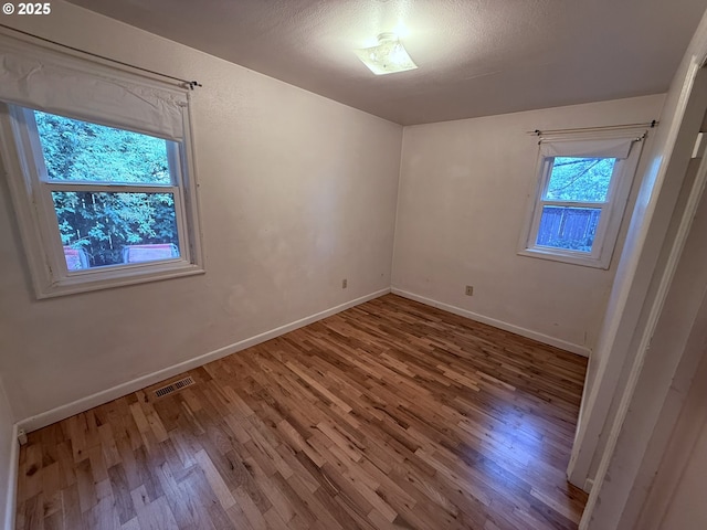 810 W 18th Ave, Eugene, OR 97402 - empty room featuring wood finished floors
