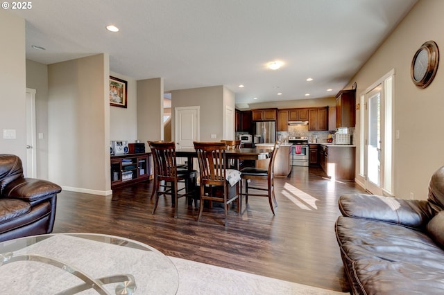 dining room featuring dark hardwood / wood-style flooring