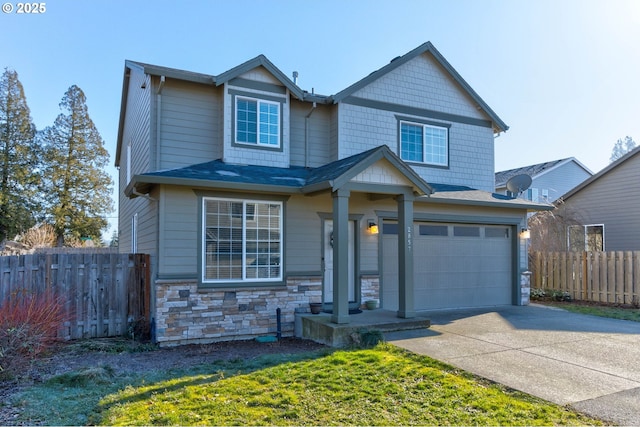 craftsman-style house featuring a garage and a front yard