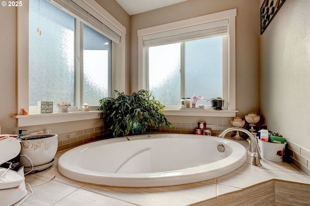 bathroom with a relaxing tiled tub