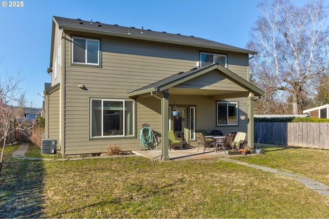 back of house featuring a yard, cooling unit, and a patio area