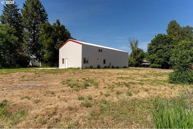 305 N Main St, Halfway, OR 97834 - view of side of home featuring an outbuilding and an outdoor structure