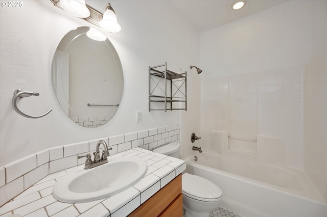 full bathroom with tasteful backsplash, shower / bathtub combination, vanity, and toilet