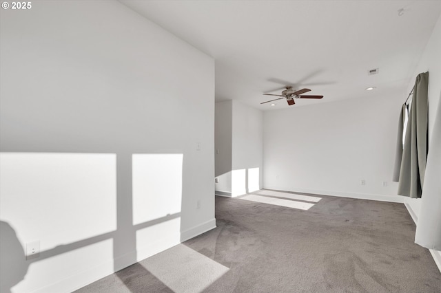 spare room featuring carpet floors and ceiling fan