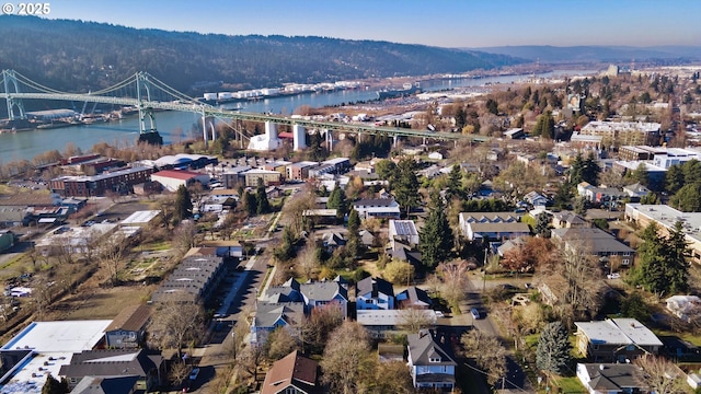 drone / aerial view with a water and mountain view