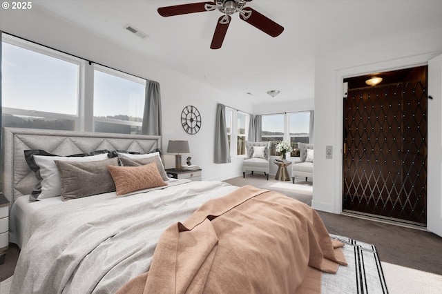 bedroom with ceiling fan and carpet floors