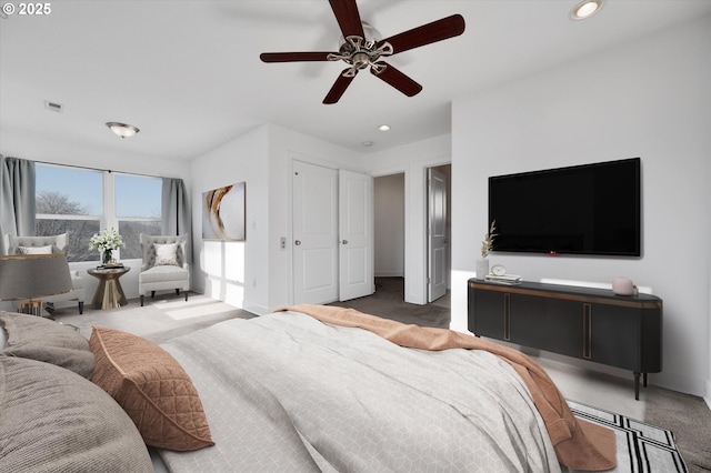 carpeted bedroom with ceiling fan