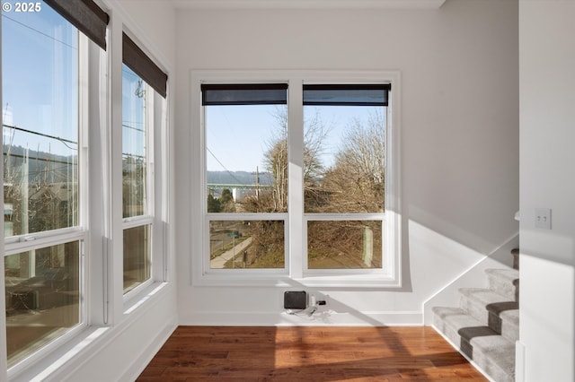 unfurnished sunroom featuring plenty of natural light