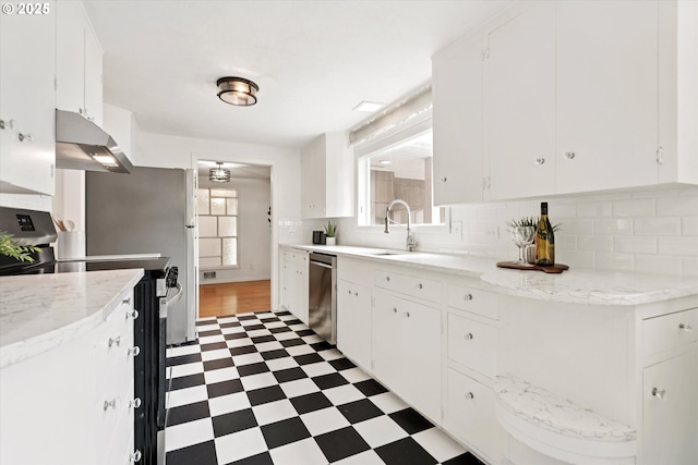10914 SW 64th Ave, Portland, OR 97219 - kitchen featuring under cabinet range hood, stainless steel appliances, tile patterned floors, and white cabinets