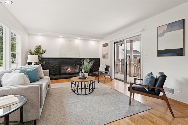 10914 SW 64th Ave, Portland, OR 97219 - living area featuring light wood-style floors, a glass covered fireplace, and recessed lighting