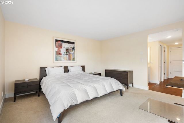 bedroom featuring recessed lighting, baseboards, and carpet