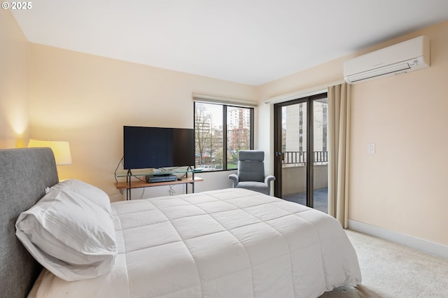 carpeted bedroom with access to exterior, baseboards, and a wall mounted AC