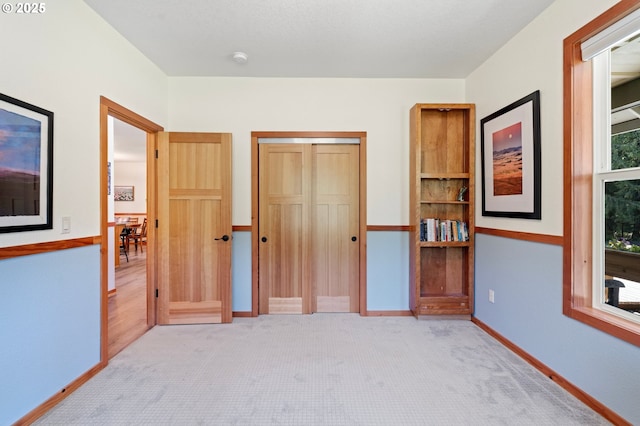 66020 Meissner Rd, Deer Island, OR 97054 - unfurnished bedroom with light carpet, a closet, and baseboards