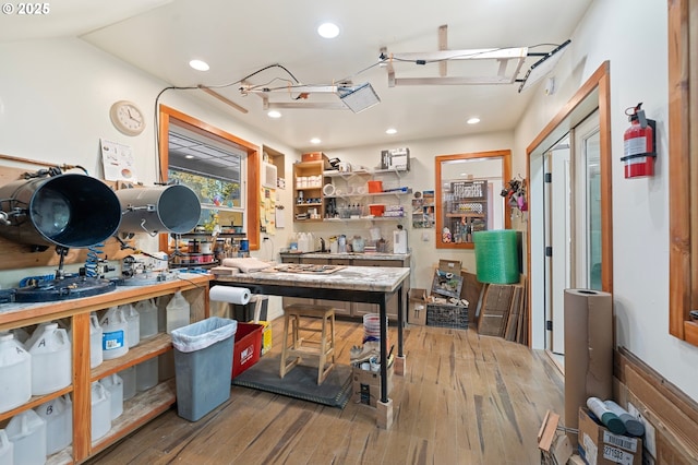 66020 Meissner Rd, Deer Island, OR 97054 - miscellaneous room featuring hardwood / wood-style floors, a workshop area, and recessed lighting