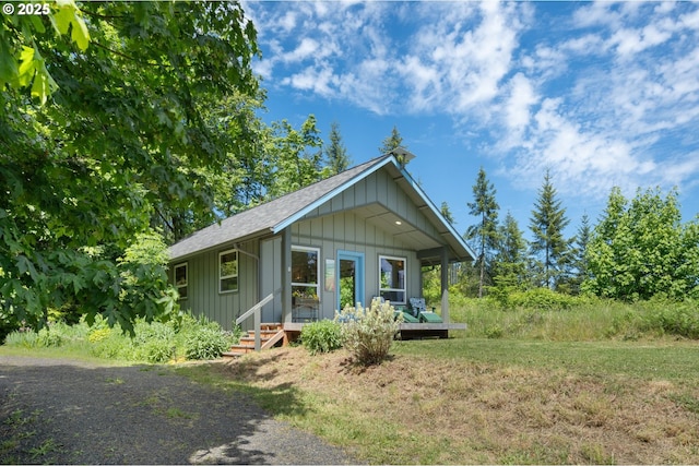 66020 Meissner Rd, Deer Island, OR 97054 - view of front of house featuring board and batten siding and a shingled roof