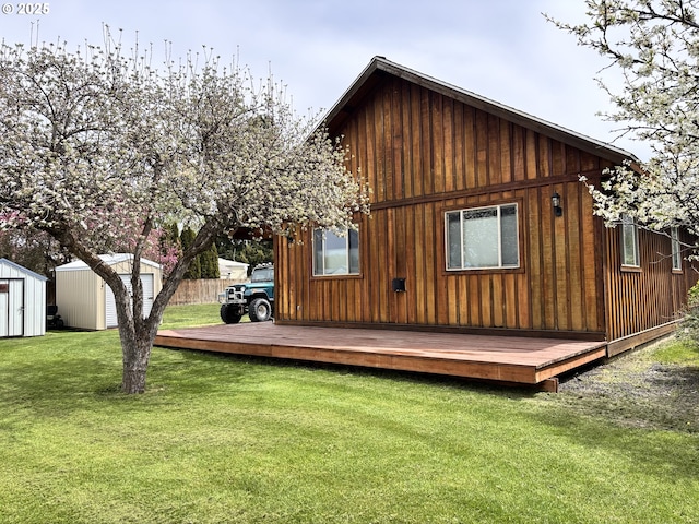 203 SE Alamo St, Enterprise, OR 97828 - back of house featuring a shed, a yard, and a wooden deck
