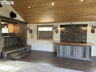 unfurnished living room with wood ceiling, a fireplace, wood finished floors, baseboards, and vaulted ceiling
