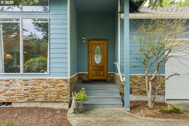 property entrance with stone siding