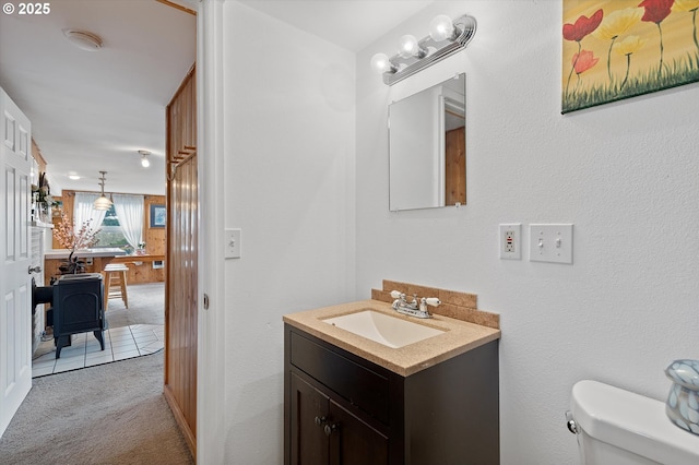 bathroom featuring toilet and vanity