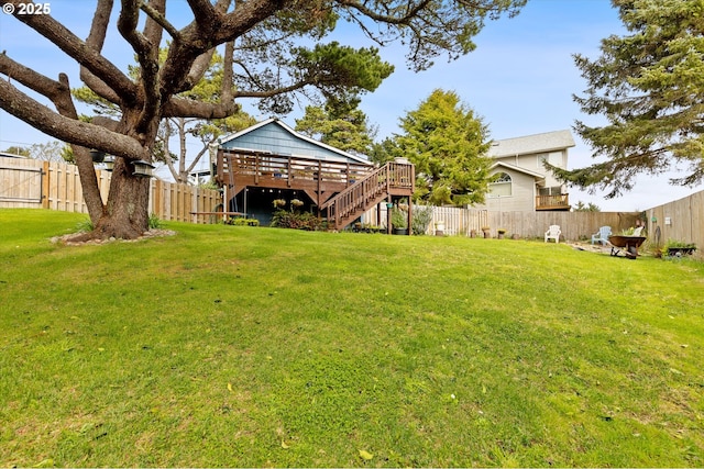 view of yard with stairway, a fenced backyard, and a wooden deck