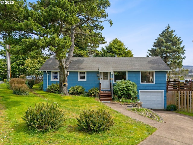 ranch-style home featuring a garage, roof with shingles, fence, a front lawn, and concrete driveway