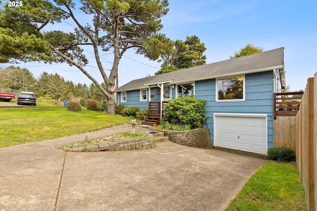 single story home featuring an attached garage, driveway, and a front yard