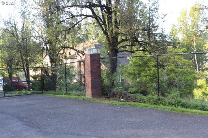 view of gate featuring fence