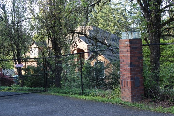 view of gate featuring fence