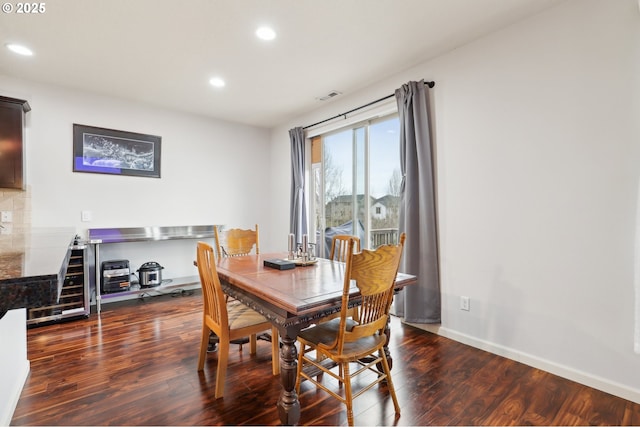 dining space with baseboards, visible vents, wine cooler, dark wood-style flooring, and recessed lighting