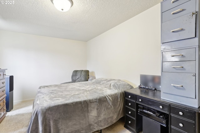 bedroom featuring a textured ceiling, baseboards, and light colored carpet