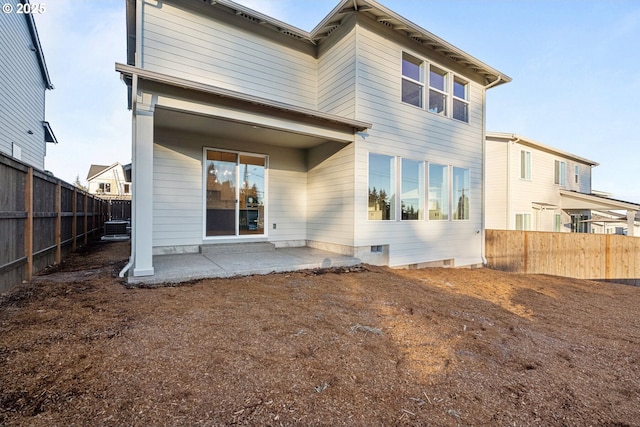 back of house with a patio