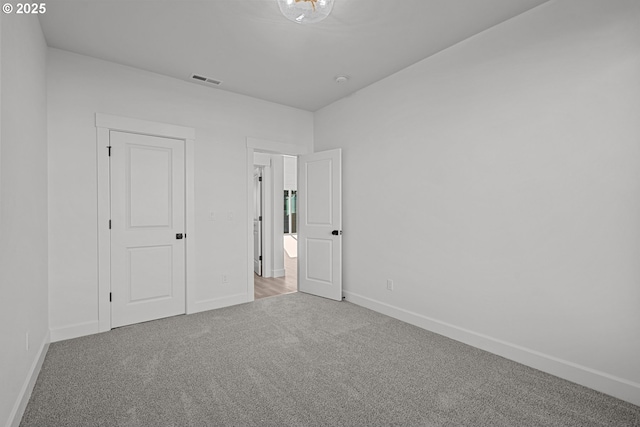 unfurnished bedroom with carpet