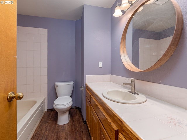 full bath featuring vanity, toilet, and wood finished floors