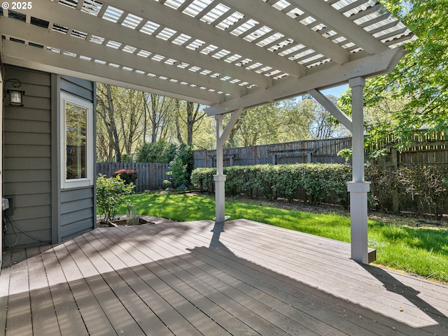 wooden deck with a fenced backyard, a pergola, and a yard