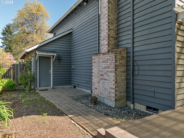 view of side of property featuring fence