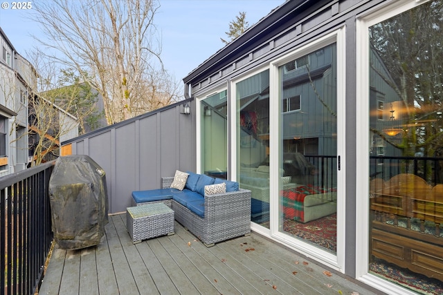 wooden deck with an outdoor hangout area