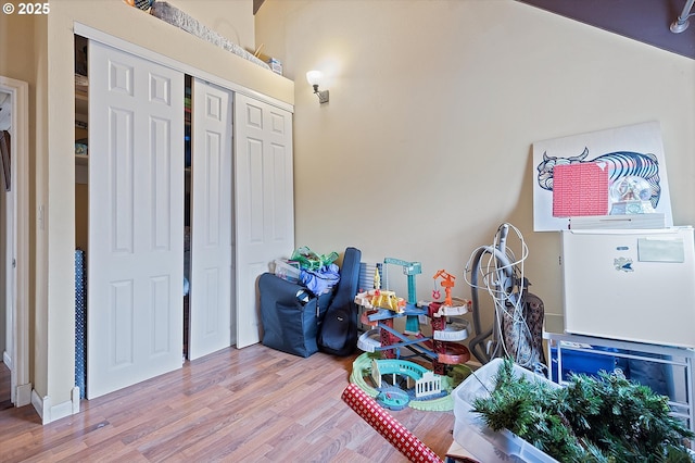 game room featuring light wood-type flooring