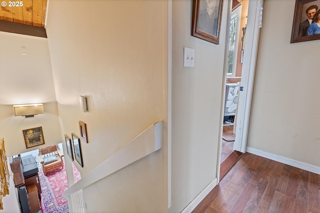 corridor featuring dark hardwood / wood-style flooring