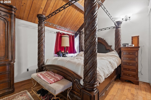 bedroom featuring lofted ceiling, wooden ceiling, and light hardwood / wood-style flooring