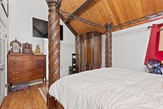 bedroom featuring wood ceiling, lofted ceiling with beams, and hardwood / wood-style flooring