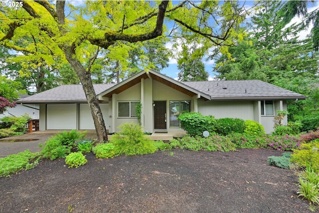 view of front of property featuring an attached garage and driveway