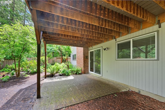 view of patio / terrace featuring fence