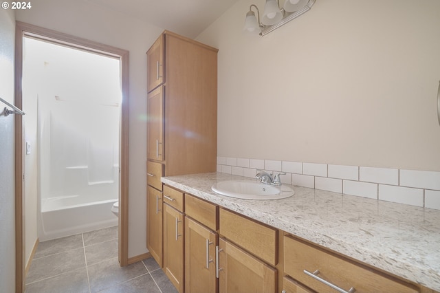 full bathroom featuring vanity, bathtub / shower combination, tile patterned floors, and toilet