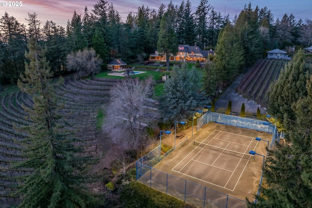 aerial view featuring a wooded view